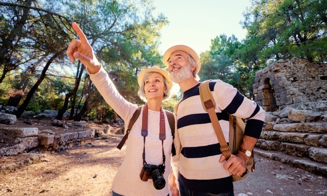 Elderly couple enjoying walking on their travels